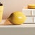 Ceramic vessel fillers, these simple lemon forms are a perfect complement to a traditional bowl or plate. With a shiny,...