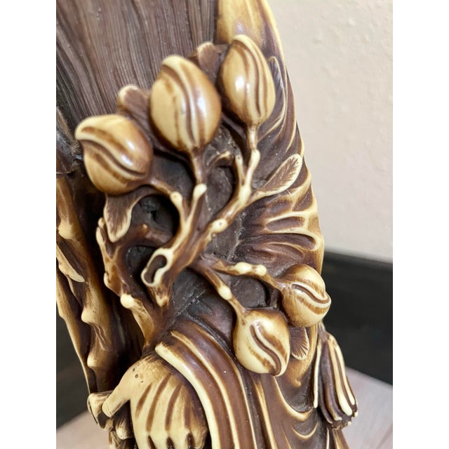 Enhance your collection with this beautifully detailed Asian figural statue depicting Shou Lao, the traditional Daoist god...