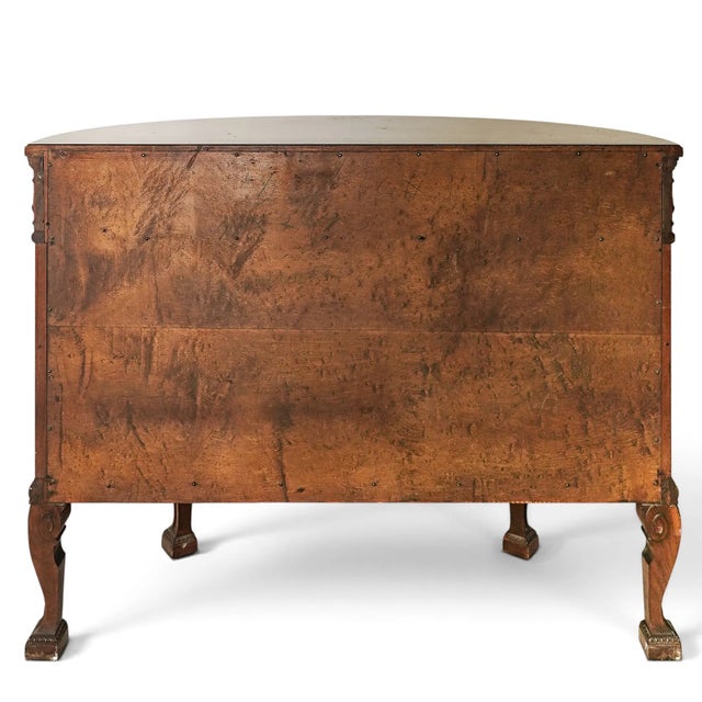 This Burr Walnut Louis XVI Revival Demilune Wood Cabinet is a stunning piece of furniture with a rich brown antique...