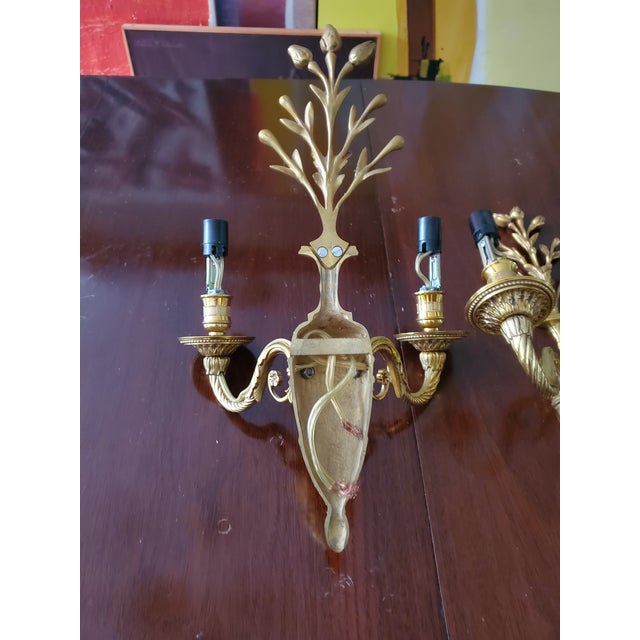 A superb pair of vintage Maison Charles style gilt gold sconces. Having rich triple plated gold patina with solid cast...