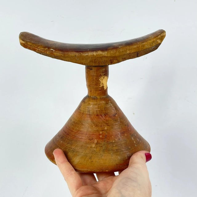 Ethiopian headrests come in various forms. They range from simple to elaborately carved artifacts. They have abstract...