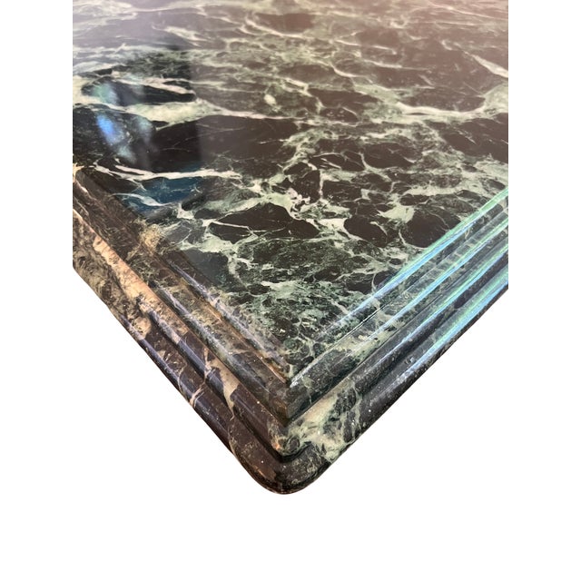 Description: Stunning vintage green marble pedestal table featuring a bold, sculptural silhouette and richly veined...