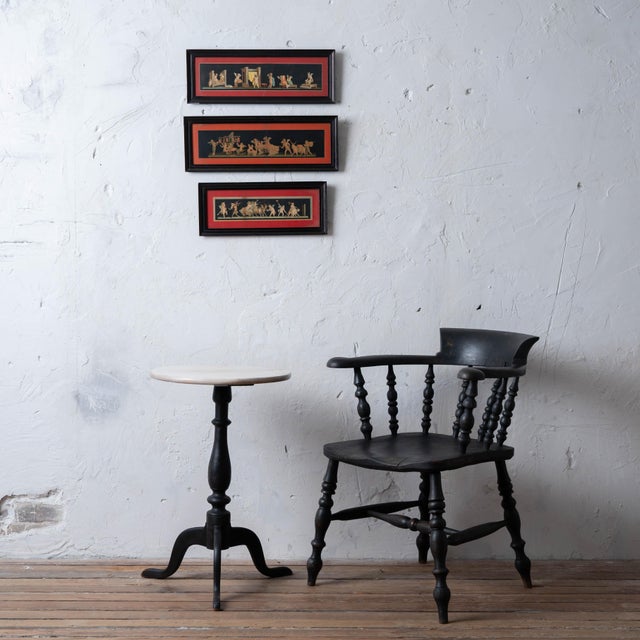Three chromolithographs after Geremia Discanno, each a long narrow frieze of winged amorini on a black ground, set in deep...