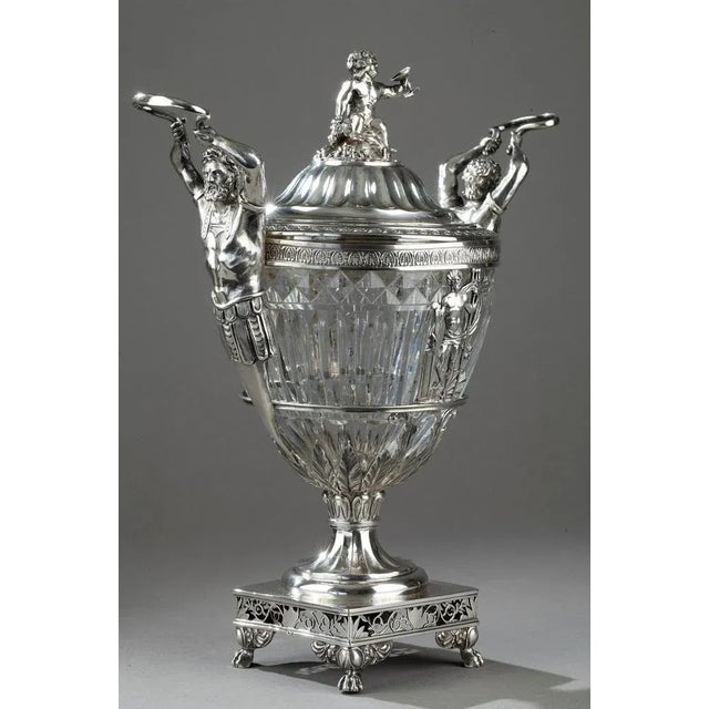 A candy dish in silver and blown crystal cut in oves and cut known as "diamond point". The candy dish is decorated with...