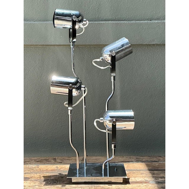 A striking example of Van Teal's innovative lighting design, this vintage chrome multi-light lamp combines sculptural form...