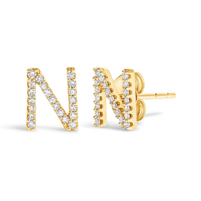 Expertly crafted to symbolize individuality and grace, this exquisite "N" initial stud earring is fashioned from radiant...