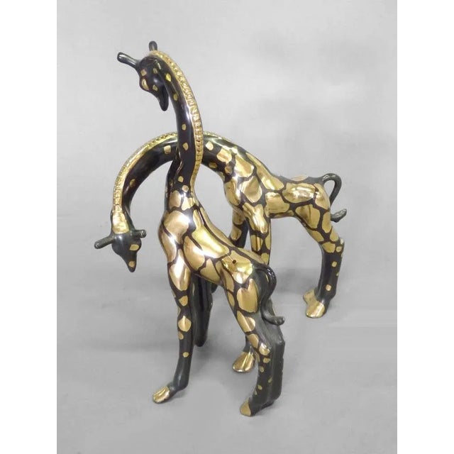 Pair of Studio Ceramic Giraffes, Wonderful Form . Gold over matte black glaze . From the studio of Frank Engle ....