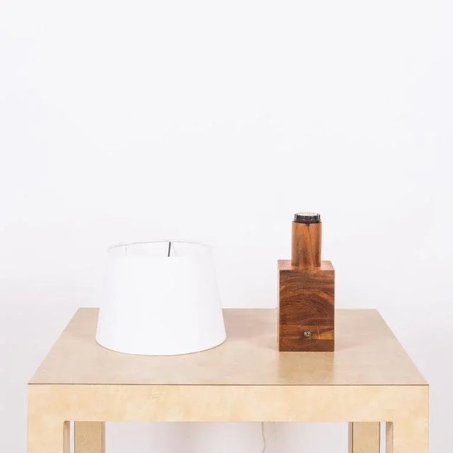 Small minimalist teak lamp with parchment paper shade. Great as a desk lamp or where a small lamp is needed. Dimensions...
