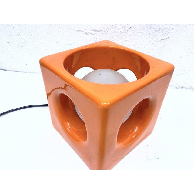 One 1970s table lamp, single-bulb, E14 socket. Orange glazed ceramic and glass. Good used condition. Minor wear and...