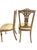Cream wood chairs with gold detailing carved into the back. Seat is covered in a shiny ivory fabric with a subtle floral...