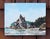 Rialto Beach II captures the rugged beauty of the Washington coastline, showcasing dramatic rock formations against a...