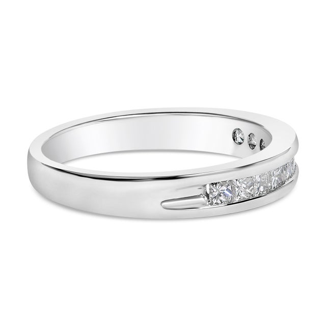 Elegant and timeless, this diamond wedding band features 1/2 carat total weight of diamonds with an astonishing eleven...