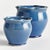 What makes these pots unique is the deep blue glaze. The ruffle rim detail at the top adds a feminine touch. The perfect...