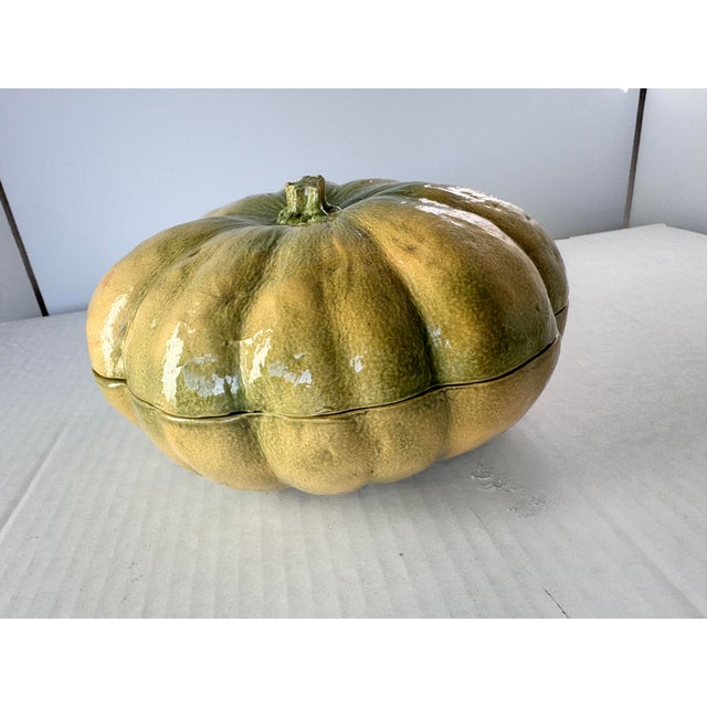 A harvest style lidded dish of a squash. This piece is beautifully glazed with lifelike color variations. Add this to a...