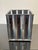 The set comprises three complementary pieces, all in chromed metal, characteristic of the minimalist industrial style...