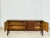 For sale is a high-quality vintage teak sideboard from the 1970s. This piece of furniture impresses with its clean, mid-...