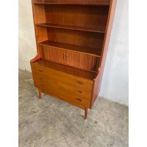 Tall Danish Modern Bookcase with Secretary Desk by Johannes Sorth. Tambour door and drawers. Adjustable shelves.