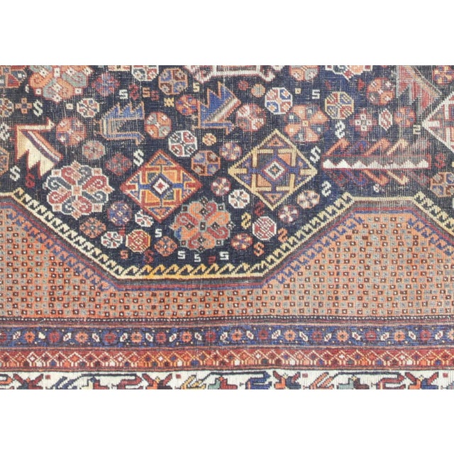 This authentic hand-woven Persian Shiraz rug originates from Southern Iran's renowned weaving region. Measuring 7'9" x...