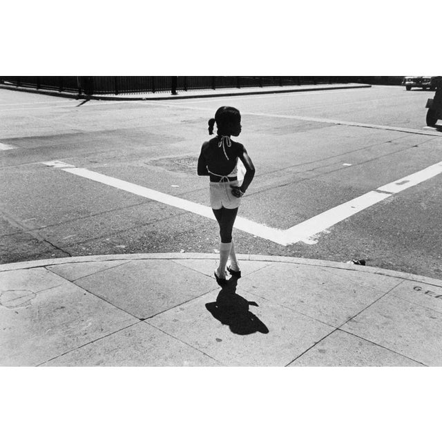 Girl on street corner, Chicago is a Black and White Print of Hahnumuhle paper available in this size of 8" x 10" in an...