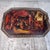 The large octagonal tray finely hand-painted with The Family of Darius before Alexander the Great, depicting Alexander and...