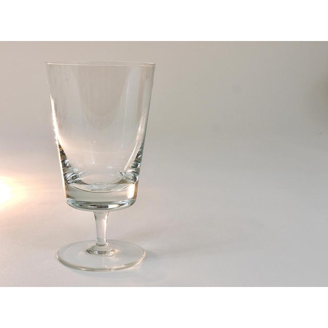 A set of six elegant and fine handmade drinking glasses for wine or water, made of clear crystal glass. Designed by Oswald...