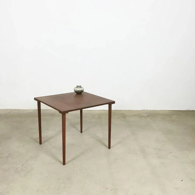 Teak side table. Designed by Peter Hvidt & Orla Mølgaard. Produced by France and Son and France & Daverkosen, 1960s. This...