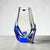 This Japanese crystal vase reveals its drama in the meeting of cobalt blue and clear glass, cut into sharp faceted planes...