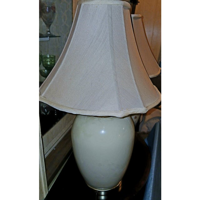 Mid-Century Chinoiserie ceramic ginger jar table lamps. Gorgeous floral design with gold trim on a cream or beige ceramic...