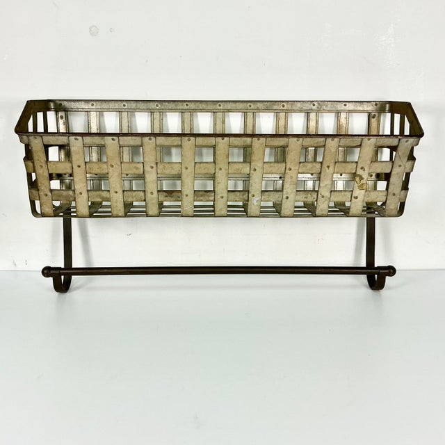 This is a great wall-mounted shelving storage solution with Farmhouse charm. It’s all metal a woven gridded basket shelf....