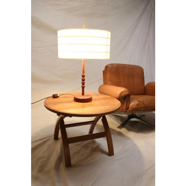 A table lamp in good used condition This piece is attributed to the mentioned designer/maker. It has no attribution mark...