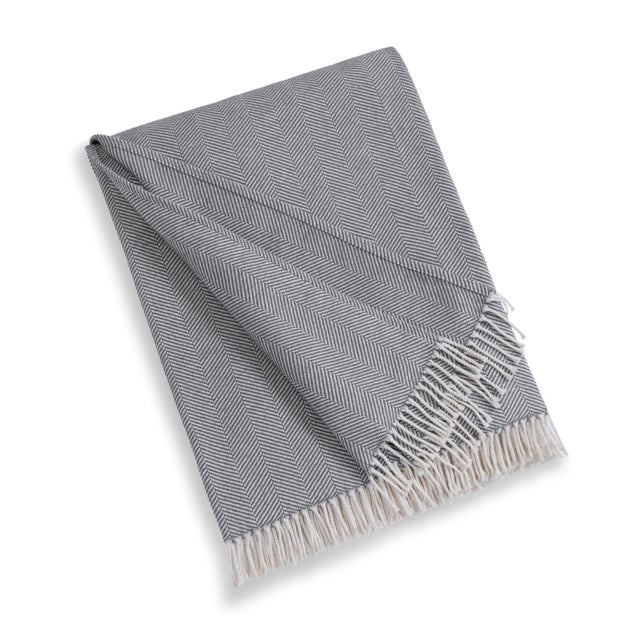 Crafted in Portugal from 100% cotton, our Madeira Throw Blanket provides a soft and comforting layer for any bed or cozy...