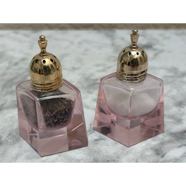 Rare pink glass salt and pepper shakers with gold tops by Mikasa. Sweet petite and solid in a diamond shape. Perfect for...