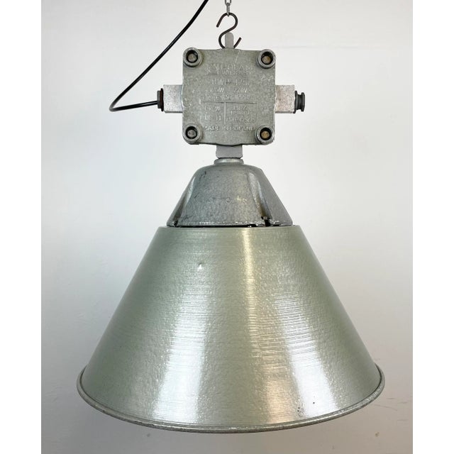 Industrial factory light manufactured by Polam Wilkasy in Poland during the 1970s. It features a cast aluminium body, an...