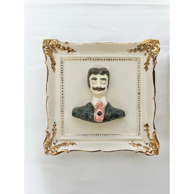 Add charm and personality to your wall décor with this unique vintage pair of porcelain wall plaques, featuring a...