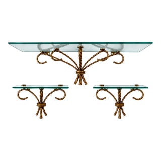 Striking Vintage Set of Three Hollywood Regency Wall Shelves Featuring Sculptural Gilt-Tone Metal Ropework and Clear Glass Shelves For Sale