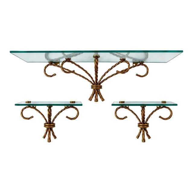 Striking Vintage Set of Three Hollywood Regency Wall Shelves Featuring Sculptural Gilt-Tone Metal Ropework and Clear Glass Shelves For Sale