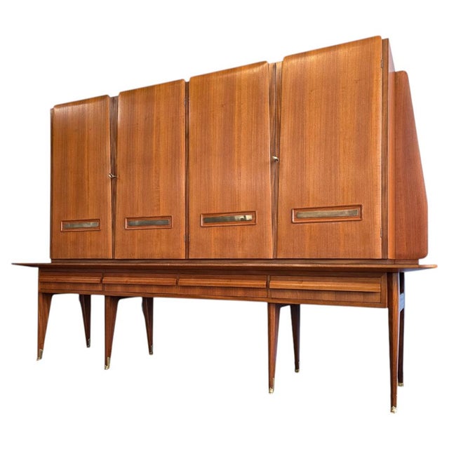 Italian Mid-Century Modern storage cabinet, sideboard, or dry bar, 1950s–1960s. Crafted in teak with finely selected...