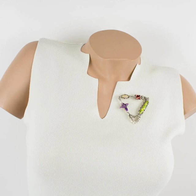 This stunning Christian Lacroix Paris rare brooch boasts a brutalist modernist triangle shape in silvered metal, all...