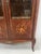 Transition-style marquetry veneer display cabinet Chamfered uprights on two cabriole legs Scalloped apron with gilt bronze...