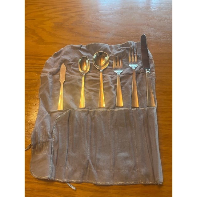 Twelve five piece place settings of vintage Allan Adler hand-hammered sterling flatware in his Sunset pattern. Adler's...