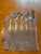 Twelve five piece place settings of vintage Allan Adler hand-hammered sterling flatware in his Sunset pattern. Adler's...