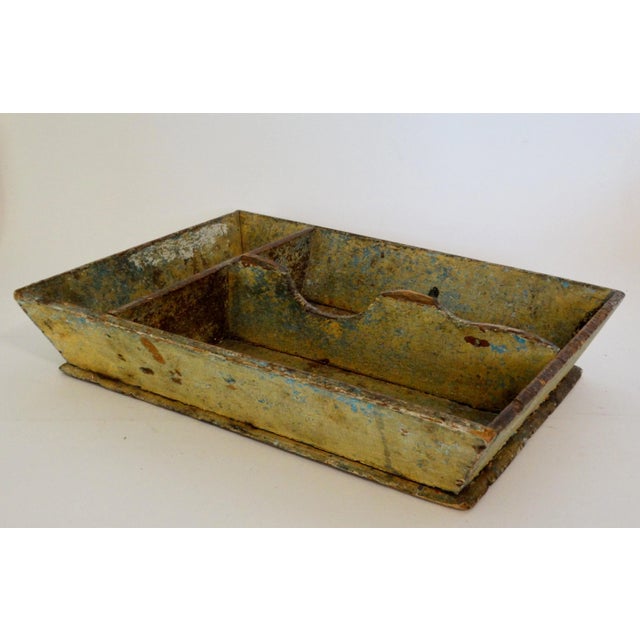 Early 19th-Century Americana mustard colored painted tray with center and end dividers, canted sloped sides and protruding...