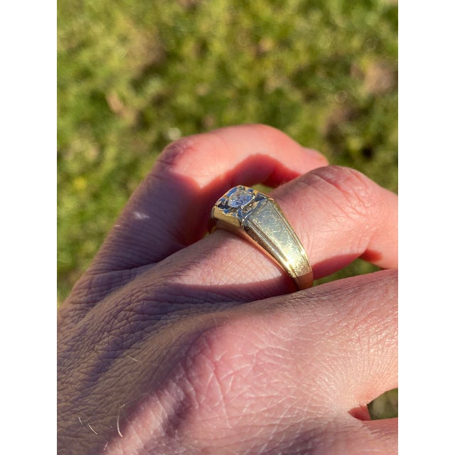 The Holbrook: Gentleman's Yellow Gold and Natural Diamond Ring. This captivating ring highlights a central 0.42-carat...