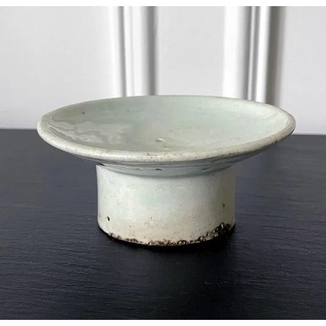 A ceramic dish with high cylindrical foot in white glaze from Korea, circa 19th century late Joseon Dynasty. By shape,...