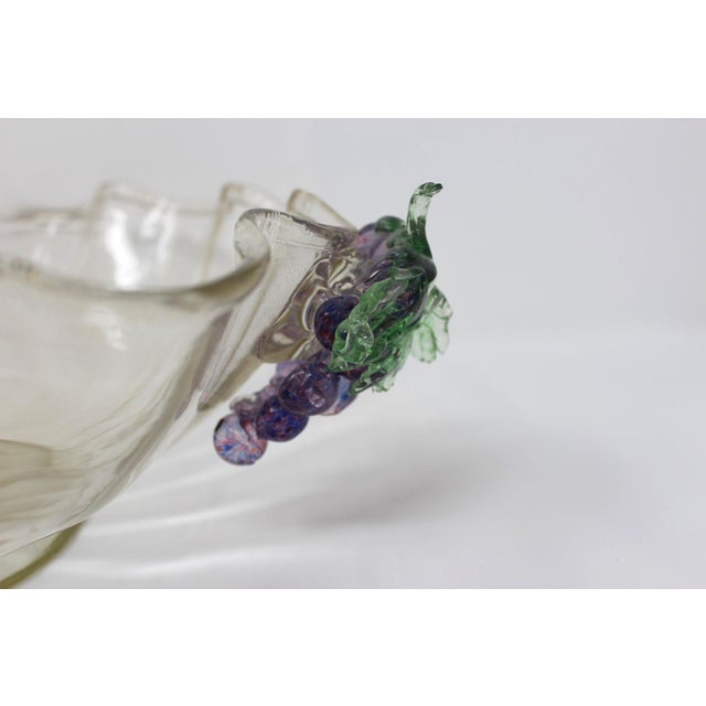This lovely bowl features hand-formed grape clusters for handles, and is beautifully colored in an amethyst shade. Vintage...