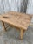 Mid/late 1890s rustic European pine dining table with stretcher base.