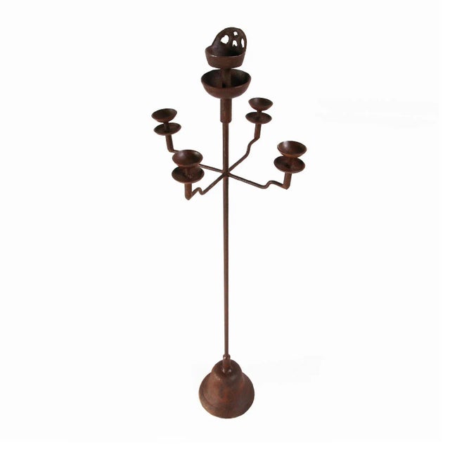 Vintage iron Shanxi candle stand in medium size. These are available in medium and large size. Each is sold separately....