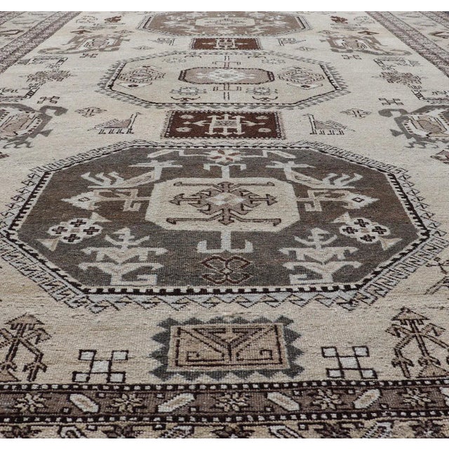 Vintage Ardebil carpet with Stylized tribal motifs in very Pale Green, Ivory, Mocha, Camel, Brown & Gray with three...
