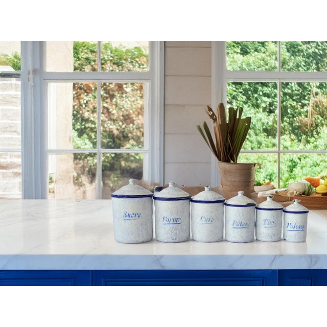 Add a touch of vintage French charm to your kitchen with this set of six enameled canisters from the 1920s. Each canister...
