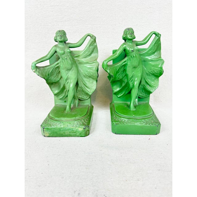 Beautiful antique Art Nouveau/Art Deco "Fire Dance" flapper bookends. They were designed and manufactured by various...